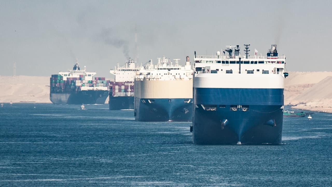 A cargo ship drives the Suez Canal.